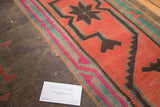 Finely woven flat weave vintage Kilim with geometric black, hot pink, teal, and brick red.