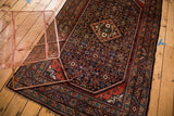 Vintage Engelas rug with classic diamond medallion and Herati pattern in brick red, navy.