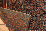 Vintage Engelas rug corner: dense hand-knotted pile, fringe, and patterned reverse weave.