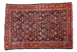 Vintage Mahal rug: dark navy field, allover intricate arabesque patterns, cherry red borders.