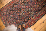 Intricate garrus patterns in dark navy field, cherry red border of vintage Mahal.