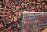 Vintage Mahal rug's intricate red, blue, saffron pile and tightly woven hand-knotted foundation.