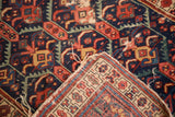 Antique Caucasian runner: hand-knotted pile, exposed foundation, tatter, and pomegranate pattern.