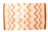 Southwestern hand woven Navajo rug with serrated gold, ivory, and caramel stripes.