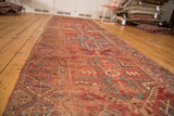 Collector Anatolian runner: hand-knotted geometric motifs, textured pile, natural red, blue, ivory dyes.
