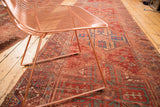 Antique Anatolian runner detail: rich red tribal patterns with natural teal and purple hues.