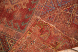 Antique Anatolian rug runner's fold, revealing its tattered edge and hand-knotted foundation.