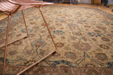 Veramin floral tendril and palmette design in blue, brown, and beige tones.