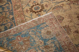 Distressed texture of Vintage Tabriz carpet, revealing beige, blue, brown Veramin floral tendrils.