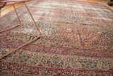 Scalloped panels with tree of life and millefleur on an antique Kerman carpet.