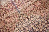 Antique Kerman panel carpet, cochineal red, navy, beige millefleur and tree of life motifs.