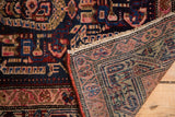 Vintage Malayer rug showcasing dark indigo floral pile and fine hand-knotted foundation with secured edge.