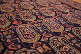 Hand-knotted vintage Persian Malayer rug with blush, bronze, and navy floral boteh motifs.