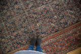 Antique Mahal runner's intricate Herati pattern, madder red border, and navy field.