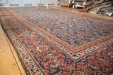 Antique Mahal rug's intricate madder root red border with detailed Herati motif field.