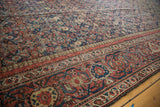 Antique Mahal rug border showcasing intricate Herati motif in madder red and navy.