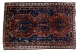 Vintage Qashqai carpet, triple trefoil medallions, deep navy and madder red field, 6'2