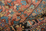 Textured hand-knotted pile with blush, sky blue, and wine red geometric motifs.