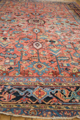 Geometric navy border with blush, sky blue patterns and low pile texture.