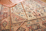 Hand-knotted vintage Mahal rug’s primitive Herati motif in ivory, rust, and blush tones.