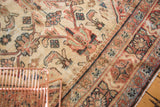 Vintage Mahal rug's primitive Herati motif in ivory, rust, pale green, showing foundation wear.