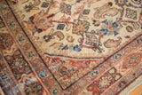 Vintage Persian Mahal carpet corner, Herati motif, ivory, rust, and visible foundation.
