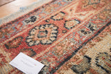 Hand-knotted pile on a vintage Mahal rug, with primitive Herati motif in rust, ivory, and green.