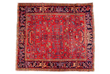 Vintage Mehrivan Heriz rug with geometric leaves on faded cherry red, navy border.