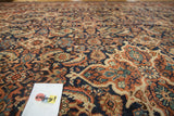 Vintage Mahal Herati motif in rust, navy, beige, and green tones with visible pile wear.
