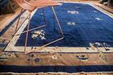 Hand-knotted Chinese Peking carpet detail: cobalt blue field, ivory and tan floral border.