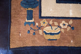Vintage Peking carpet corner with cobalt blue vase, floral motifs, ivory panel.