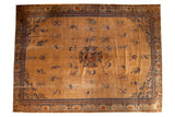 Vintage Peking carpet, antique tea brown field, central medallion, navy and cobalt stylized motifs.