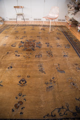 Arts and crafts stylized motifs, visible wear on vintage Peking carpet's ivory field.