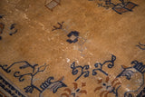 Vintage Peking rug texture with dark ivory, navy blue deco motifs, and visible foundation.