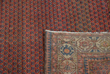 Vintage Hamadan rug's madder red mir design with its tightly hand-knotted reverse.