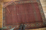 Vintage Hamadan rug's lower geometric border with navy, ivory, and gold motifs.