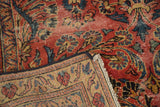 Distressed red floral field texture revealing foundation, with beige patterned border reverse side.