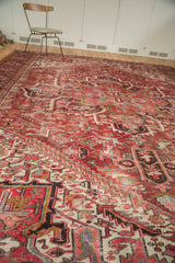 Vintage Mehrivan carpet pile with geometric floral design, featuring cherry red, ivory, and visible wear.