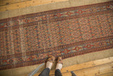 Vintage Hamadan runner with lattice panel pattern, germinating plants, and camel hair border.