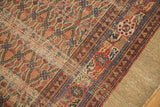 Vintage Hamadan runner's natural shorn wool edge, showing hard tatter and madder red patterns.
