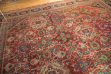 Intricate inverted Herati, vinery, and lotus palmettes on the cherry red Mahalati rug.