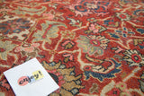 Hand-knotted Mahalati rug pile close-up, revealing cherry red field, intricate Herati motif, blue vinery, and beige.
