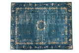 Antique Peking carpet: faded watery blue field, pale ivory medallion, floral and Tao motifs.