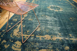 Watery blue field of the antique Peking carpet featuring pictorial Tao symbolism and floral motifs.