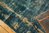 Watery blue antique Peking carpet with pale ivory floral and Tao symbolic motifs.