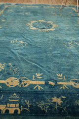 Watery blue and antique ivory pictorial border with tao symbolism on a Chinese Peking carpet.