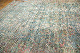 Distressed Persian Mahal carpet showcasing a faded Herati design in pale aqua and cinnamon.