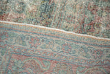 Visible hand-knotted foundation and distressed worn pile of the vintage Mahal carpet.