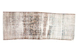 Distressed vintage Persian Mahal runner with faded Herati motif, exposed foundation, and irregular shape.