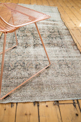 Distressed Mahal rug runner with faded Herati motifs and exposed foundation texture.